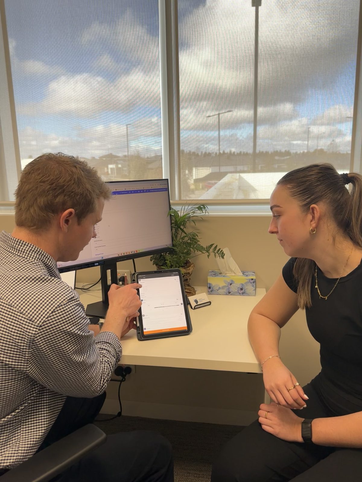 Physiotherapist reviewing assessment results with a client