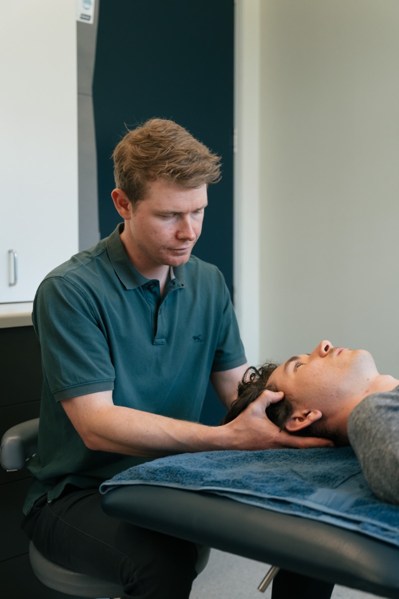 Cervical manual therapy being performed by a physiotherapist